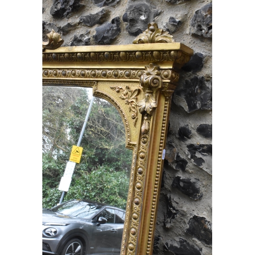 152 - A 19th century French Louis XVI style large gilt wall mirror, having a sevres style painted plaque d... 