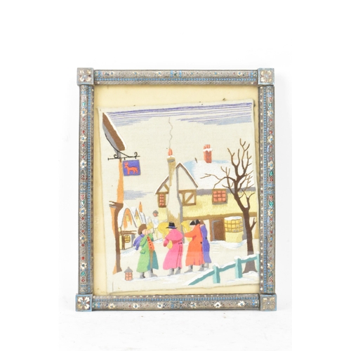 153 - A Russian silver early 20th century champleve enamel photograph frame, inset with a tapestry and bor... 