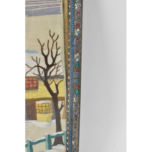 153 - A Russian silver early 20th century champleve enamel photograph frame, inset with a tapestry and bor... 