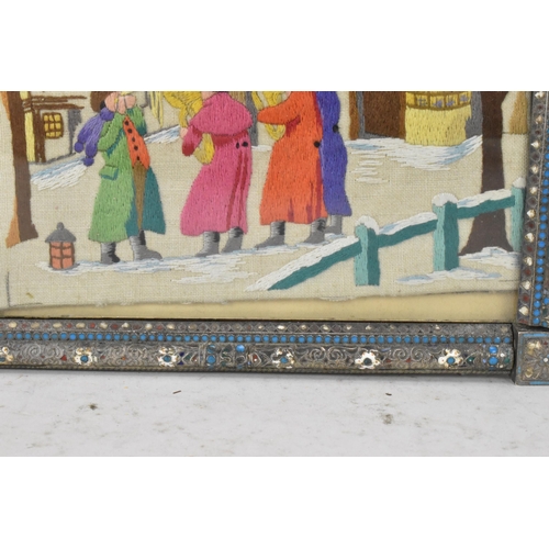 153 - A Russian silver early 20th century champleve enamel photograph frame, inset with a tapestry and bor... 