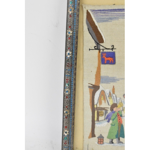 153 - A Russian silver early 20th century champleve enamel photograph frame, inset with a tapestry and bor... 