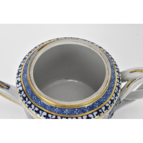 17 - A Chinese export Qing dynasty blue and white teapot and stand, late 18th century, decorated with bui... 