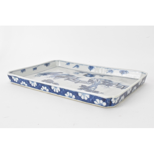 18 - A 19th century Chinese blue and white tray, of rectangular shape and painted with a scene of two fig... 