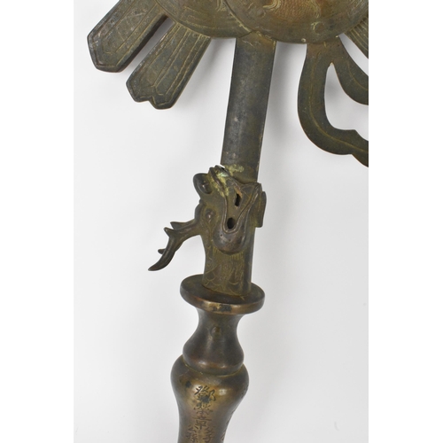 19 - A Chinese gilt metal ceremonial staff mount, the blade, issuant from a dragon's mouth and the vase-f... 