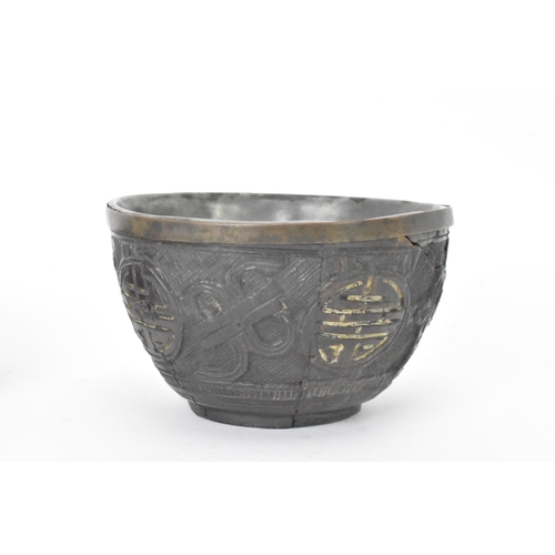 20 - A Chinese late 19th/early 20th century coconut carved cup and saucer, both with pewter liners and th... 