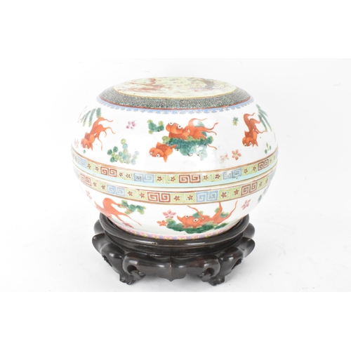 219 - Two Chinese famille rose circular formed lidded boxes, early 20th century, decorated in polychrome e... 