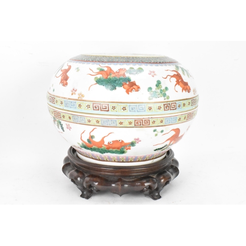 219 - Two Chinese famille rose circular formed lidded boxes, early 20th century, decorated in polychrome e... 