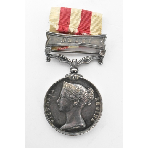 221 - A Victorian Indian mutiny medal, 1857-58, with Delhi clasp, awarded to CORPL D,DIX 61ST REGT