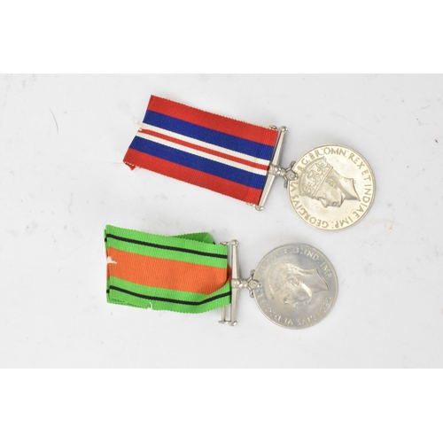 222 - A group of WWI and WWII medals to include a three medal WW1 group including a Royal fleet reserve lo... 