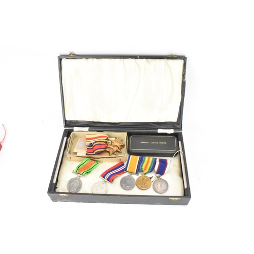 222 - A group of WWI and WWII medals to include a three medal WW1 group including a Royal fleet reserve lo... 