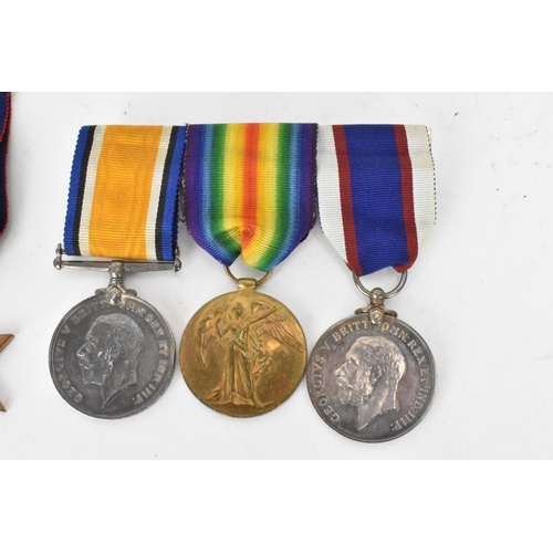 222 - A group of WWI and WWII medals to include a three medal WW1 group including a Royal fleet reserve lo... 