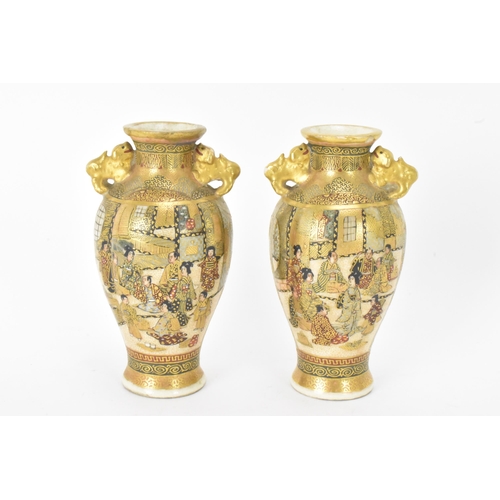 23 - A pair of Japanese Meiji Satsuma miniature vases and a later example, the pair of tapered form, the ... 