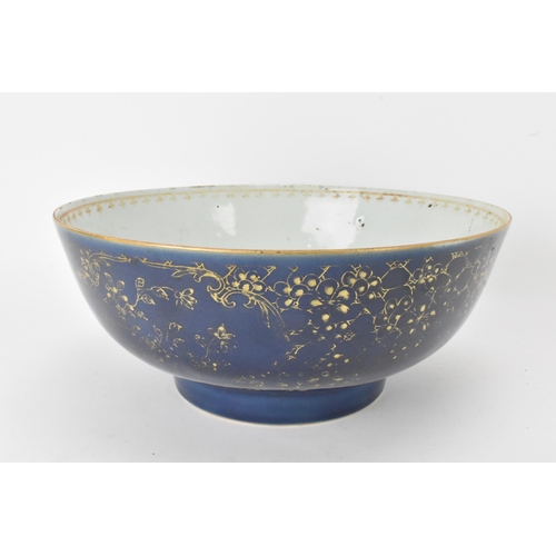 26 - A large Chinese export Qianlong footed bowl, in a powder blue glaze and decorated with gilt flora to... 