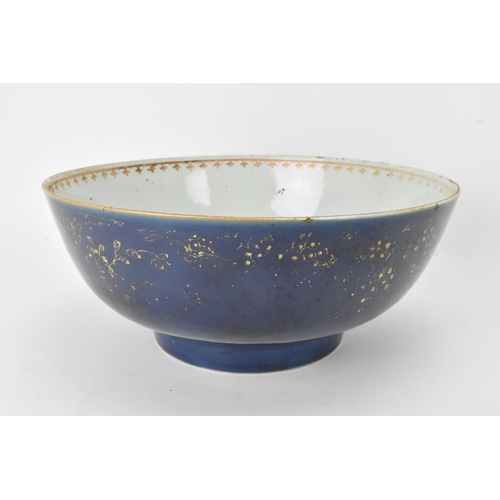 26 - A large Chinese export Qianlong footed bowl, in a powder blue glaze and decorated with gilt flora to... 