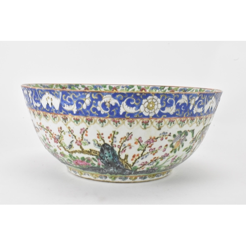 27 - A near pair of Chinese export Canton famille rose punch bowls, Qing dynasty, late 19th century, the ... 