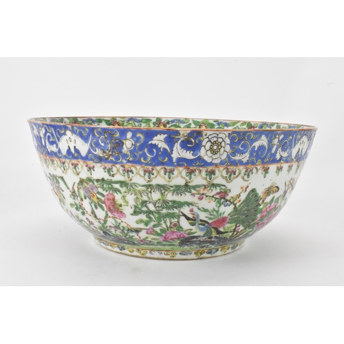 27 - A near pair of Chinese export Canton famille rose punch bowls, Qing dynasty, late 19th century, the ... 