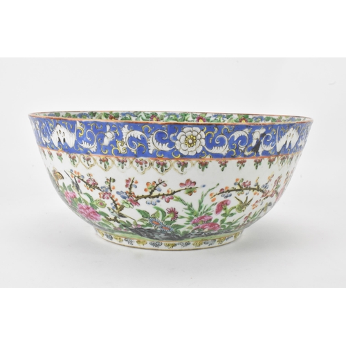 27 - A near pair of Chinese export Canton famille rose punch bowls, Qing dynasty, late 19th century, the ... 