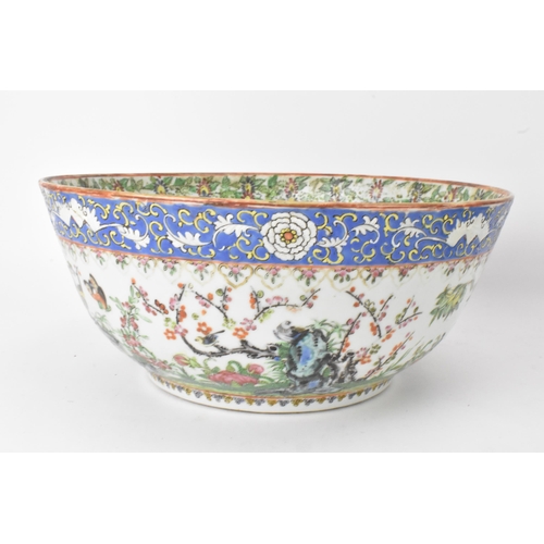 27 - A near pair of Chinese export Canton famille rose punch bowls, Qing dynasty, late 19th century, the ... 