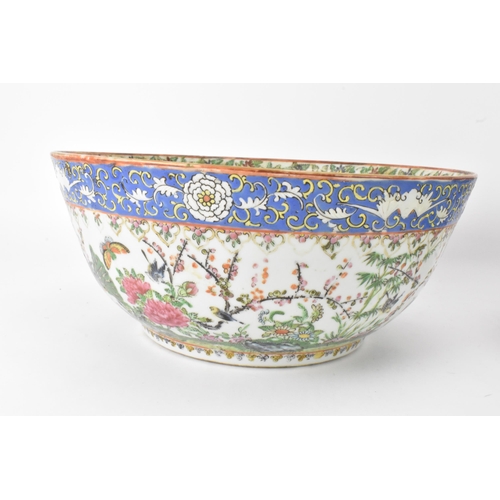 27 - A near pair of Chinese export Canton famille rose punch bowls, Qing dynasty, late 19th century, the ... 