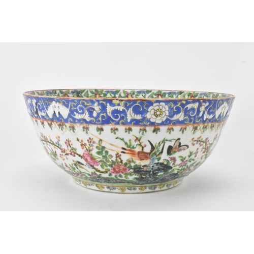 27 - A near pair of Chinese export Canton famille rose punch bowls, Qing dynasty, late 19th century, the ... 