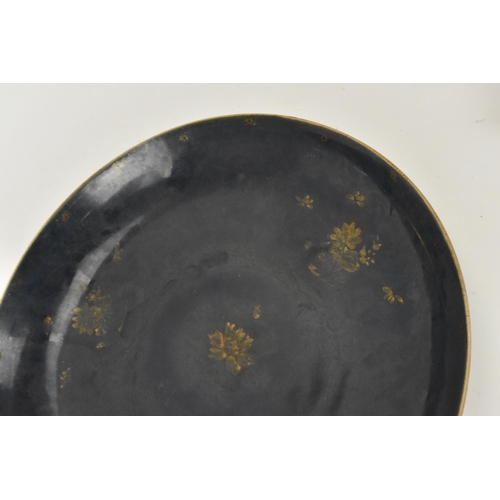 28 - A Chinese Qing dynasty large powder blue dish, early 18th century, with gilt flora interior and exte... 