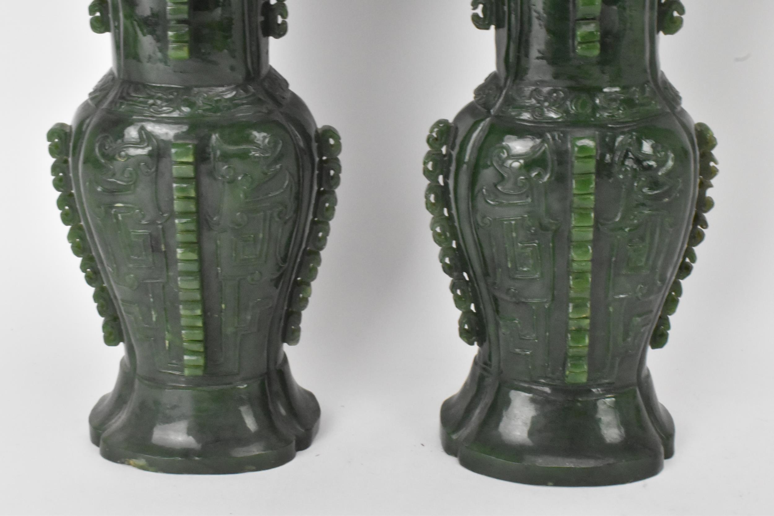 A pair of Chinese 20th century jadeite vases, of flattened baluster ...