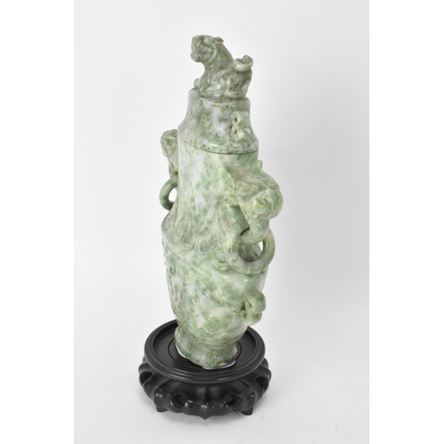 32 - A Chinese 20th century jadeite vase, of flattened baluster shape with archaistic relief decoration, ... 