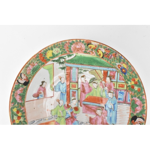 37 - A pair of Chinese export Canton Famille Rose plates, Qing Dynasty, late 19th century, each decorated... 