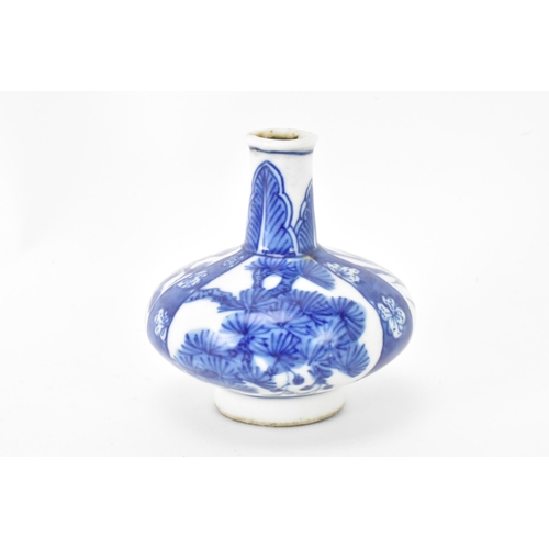 40 - A Chinese miniature vase, Kangxi period (1660-1722) of squat baluster shape decorated in blue and wh... 