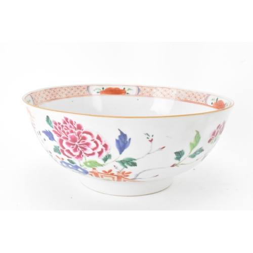 42 - A Chinese famille rose punch bowl, Qianlong, mid 18th century, painted with foliage and the border w... 