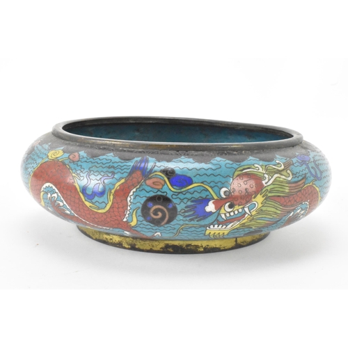 44 - A  Chinese cloisonne bowl, late 19th/early 20th century, of shallow form, decorated on a blue ground... 