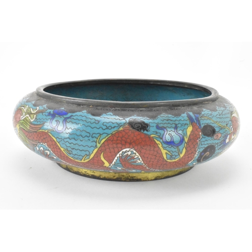 44 - A  Chinese cloisonne bowl, late 19th/early 20th century, of shallow form, decorated on a blue ground... 