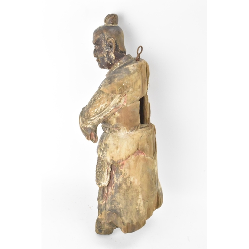 46 - A Chinese carved and painted wood figure of a warrior, late Ming/Qing dynasty, in traditional clothi... 