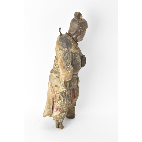 46 - A Chinese carved and painted wood figure of a warrior, late Ming/Qing dynasty, in traditional clothi... 