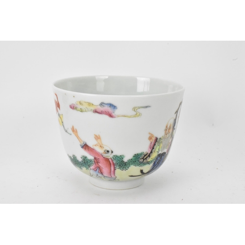 51 - Three Chinese 20th century famille rose tea bowls to include one decorated with figures seated round... 