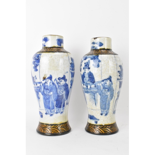 54 - A pair of Chinese Nanking crackle glazed vases blue and white vases, Qing dynasty, 19th century, bal... 