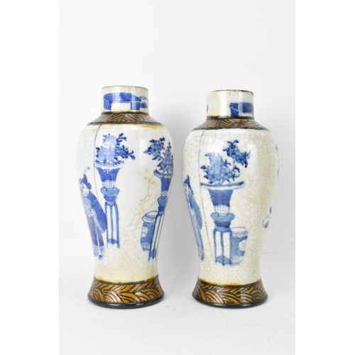 54 - A pair of Chinese Nanking crackle glazed vases blue and white vases, Qing dynasty, 19th century, bal... 