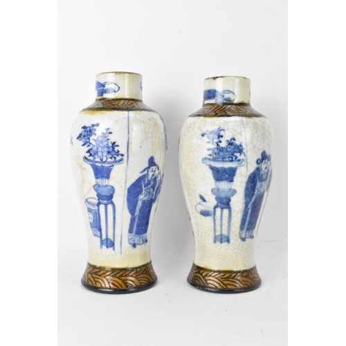 54 - A pair of Chinese Nanking crackle glazed vases blue and white vases, Qing dynasty, 19th century, bal... 