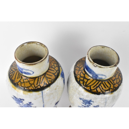 54 - A pair of Chinese Nanking crackle glazed vases blue and white vases, Qing dynasty, 19th century, bal... 