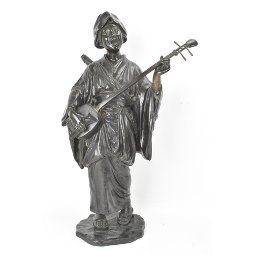 66 - A Japanese Meiji period bronze figure of a bijin musician, wearing a kimono and playing a shamisen w... 