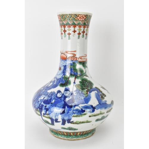 7 - A Chinese Famille Vert bottle neck vase, decorated with figures, horse and butterflies in a landscap... 