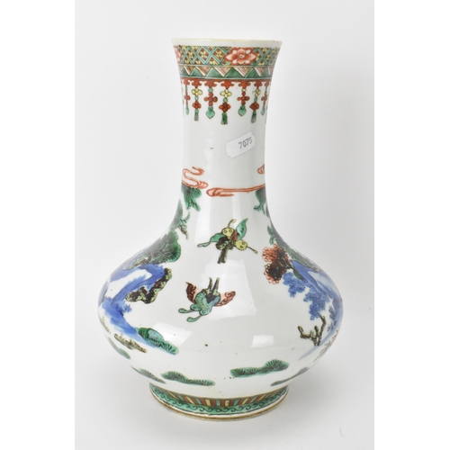 7 - A Chinese Famille Vert bottle neck vase, decorated with figures, horse and butterflies in a landscap... 