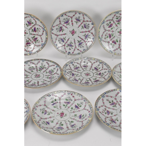 8 - A set of twelve Chinese Qing dynasty famille rose plates, 18th century, having central flower enclos... 