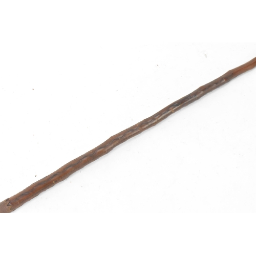 88 - An early 20th Century Southwestern European traditional Basque Makila walking cane, having a circula... 