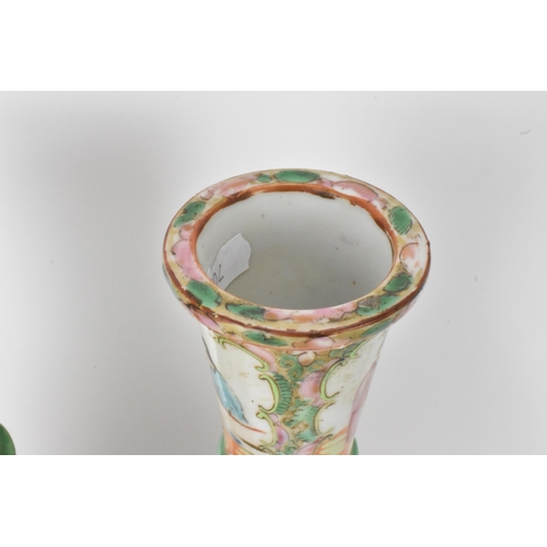 9 - A pair of Chinese late 19th century Canton Famille Rose vases, of cylindrical tapered form, the bodi... 