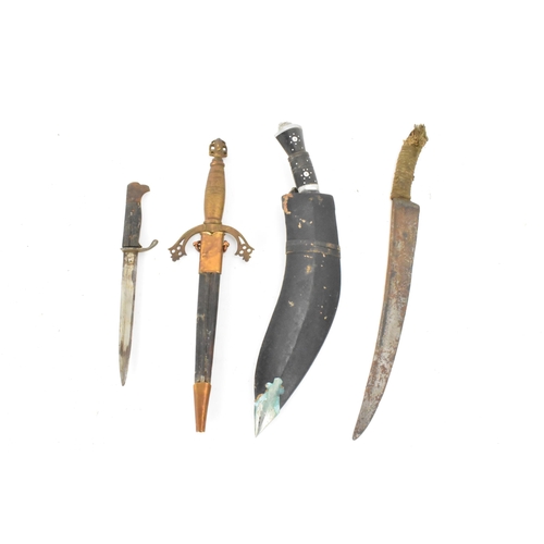 91 - Mixed weapons to include an early 20th century Gurkha (kukri) knife with two small daggers, a German... 