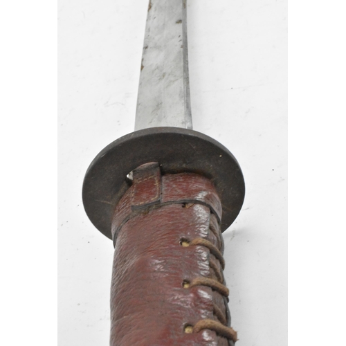 96 - A WWII Japanese officers Katana sword and scabbard, both bound in red leather, steel blade, pierced ... 