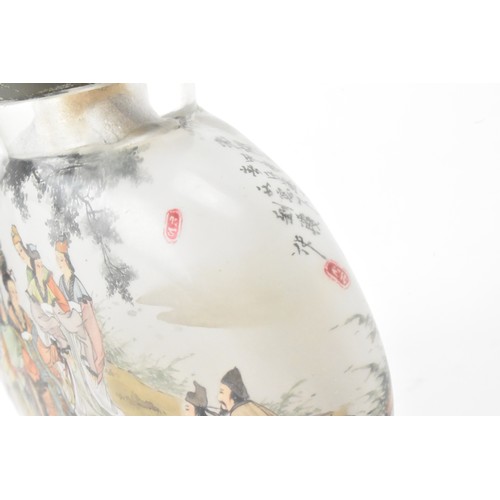 226 - Three Chinese 20th century glass painted snuff bottles, one depicting figures in conversation in a c... 