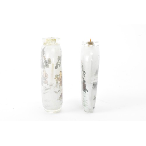 226 - Three Chinese 20th century glass painted snuff bottles, one depicting figures in conversation in a c... 