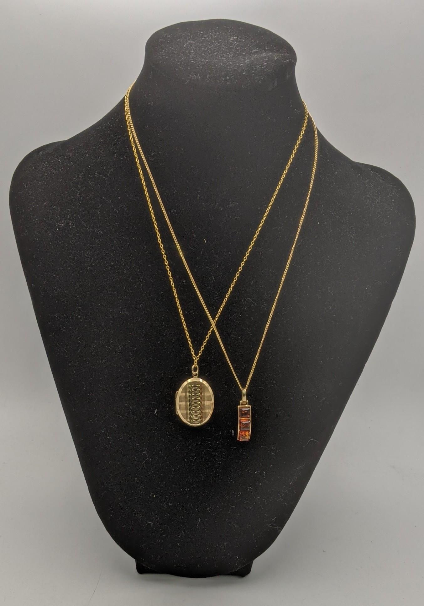 A gold front and back locket pendant on a gold necklace, tested as 9ct ...